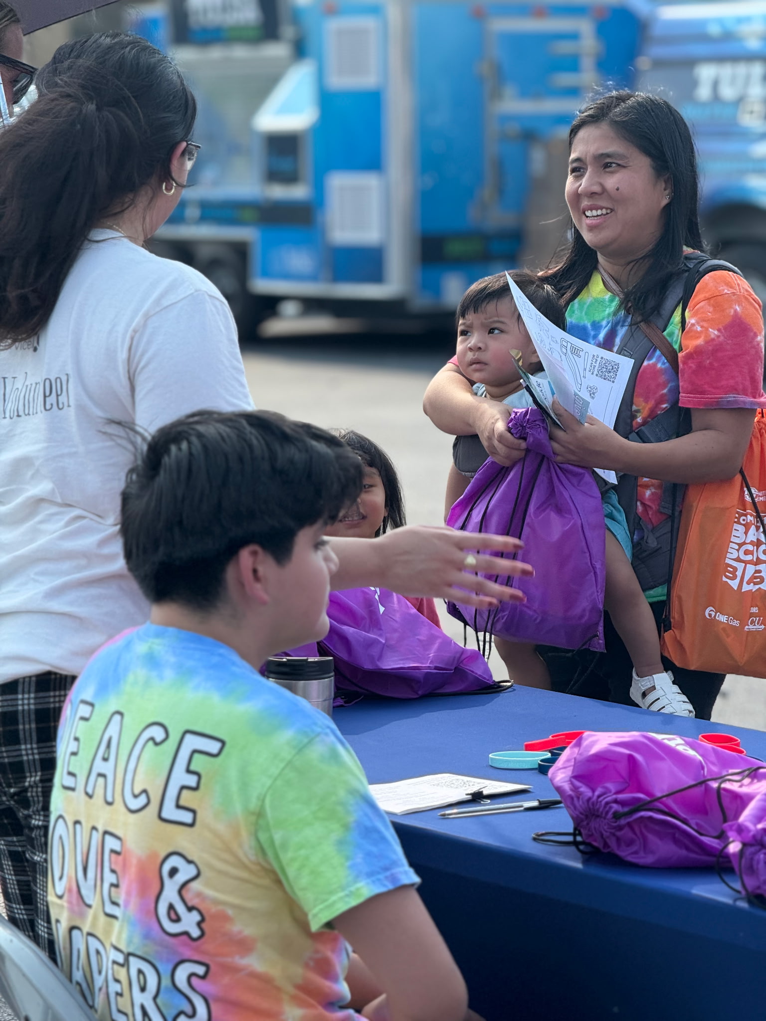 Tulsa-area families grab backpacks and visit booths with supplies and information at the fifth annual Back to School Bash on the OSU-Tulsa campus.