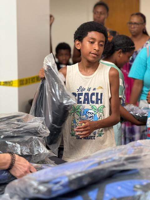 Tulsa-area families grab backpacks and visit booths with supplies and information at the fifth annual Back to School Bash on the OSU-Tulsa campus.