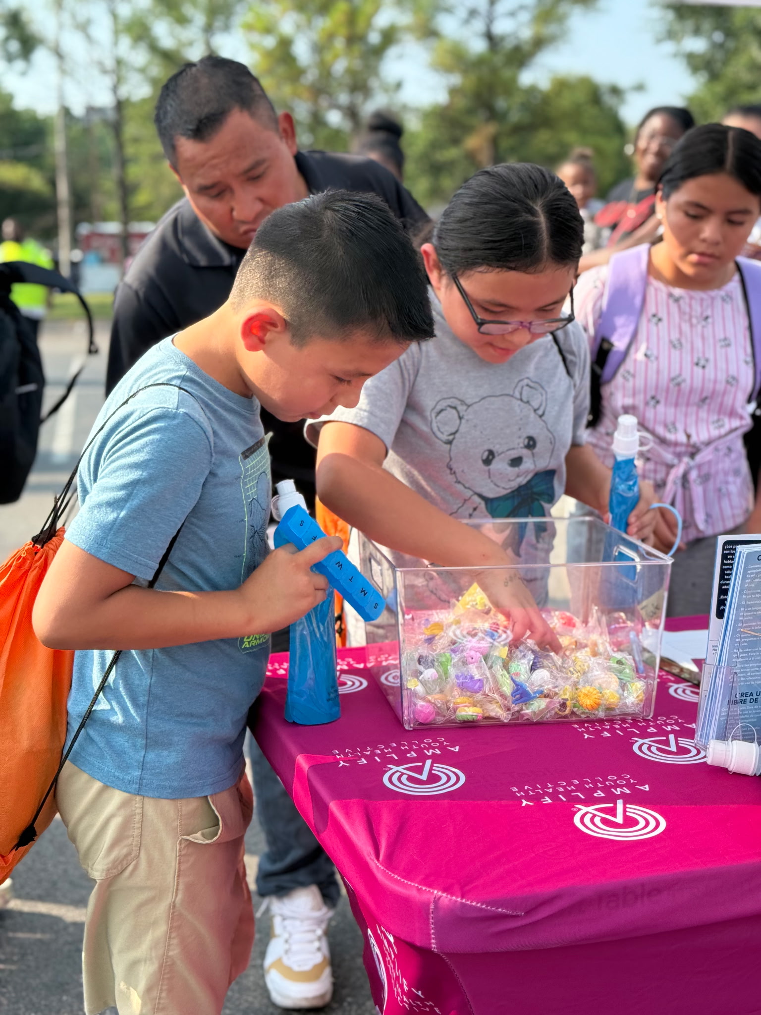 Tulsa-area families grab backpacks and visit booths with supplies and information at the fifth annual Back to School Bash on the OSU-Tulsa campus.