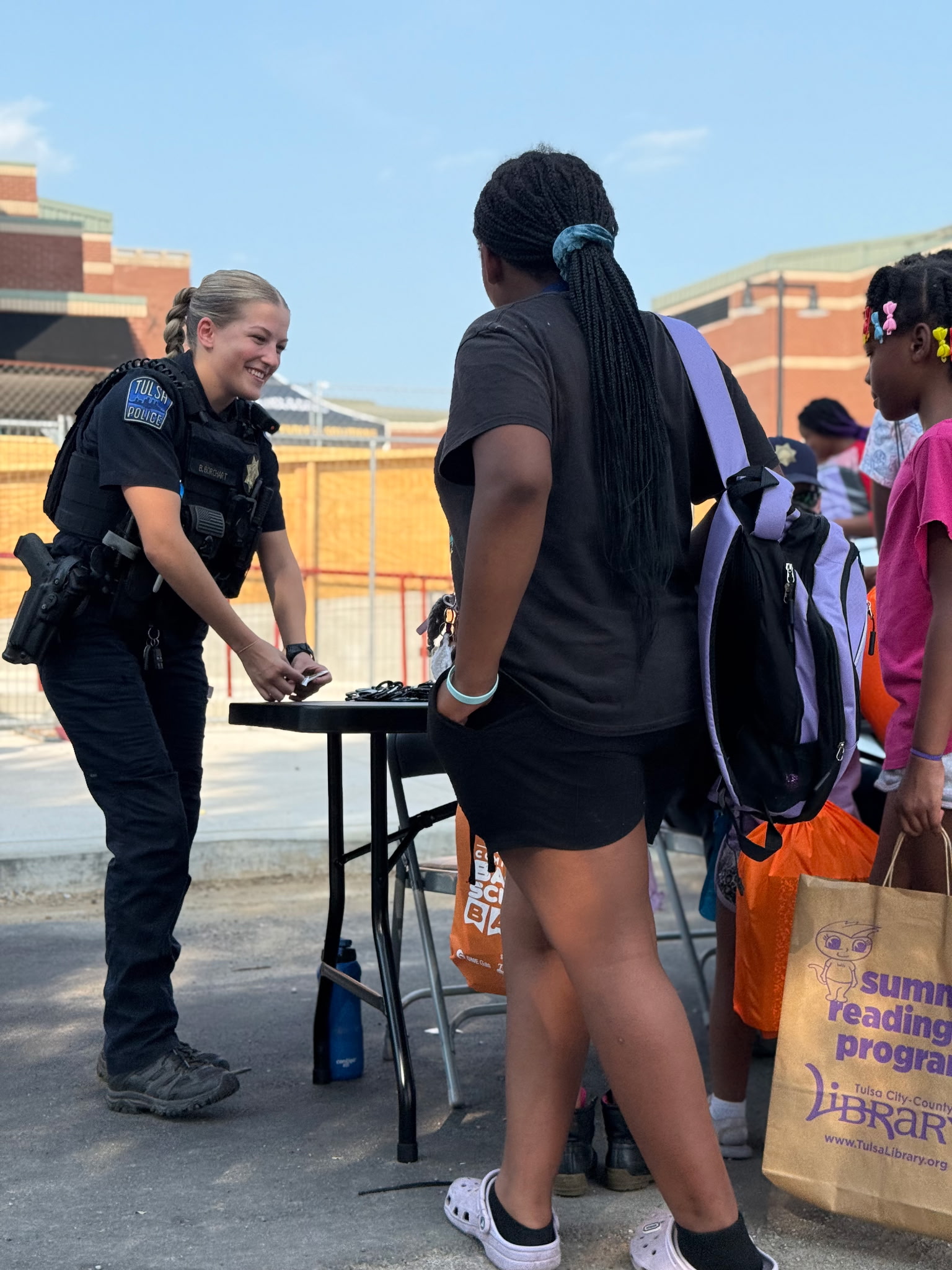 Tulsa-area families grab backpacks and visit booths with supplies and information at the fifth annual Back to School Bash on the OSU-Tulsa campus.