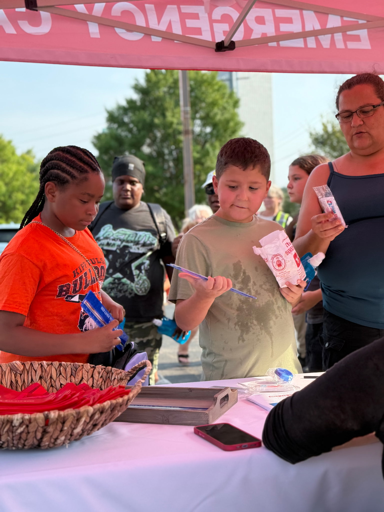 Tulsa-area families grab backpacks and visit booths with supplies and information at the fifth annual Back to School Bash on the OSU-Tulsa campus.