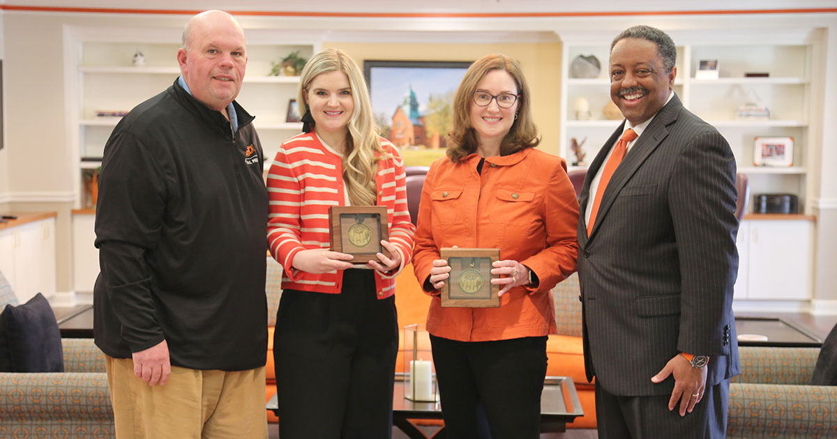 From left to right: OSU-Tulsa interim president Dr. Johnny Stephens, Ashlyn Fiegener, Amanda Morris, and OSU-Tulsa interim vice provost Craig Freeman.