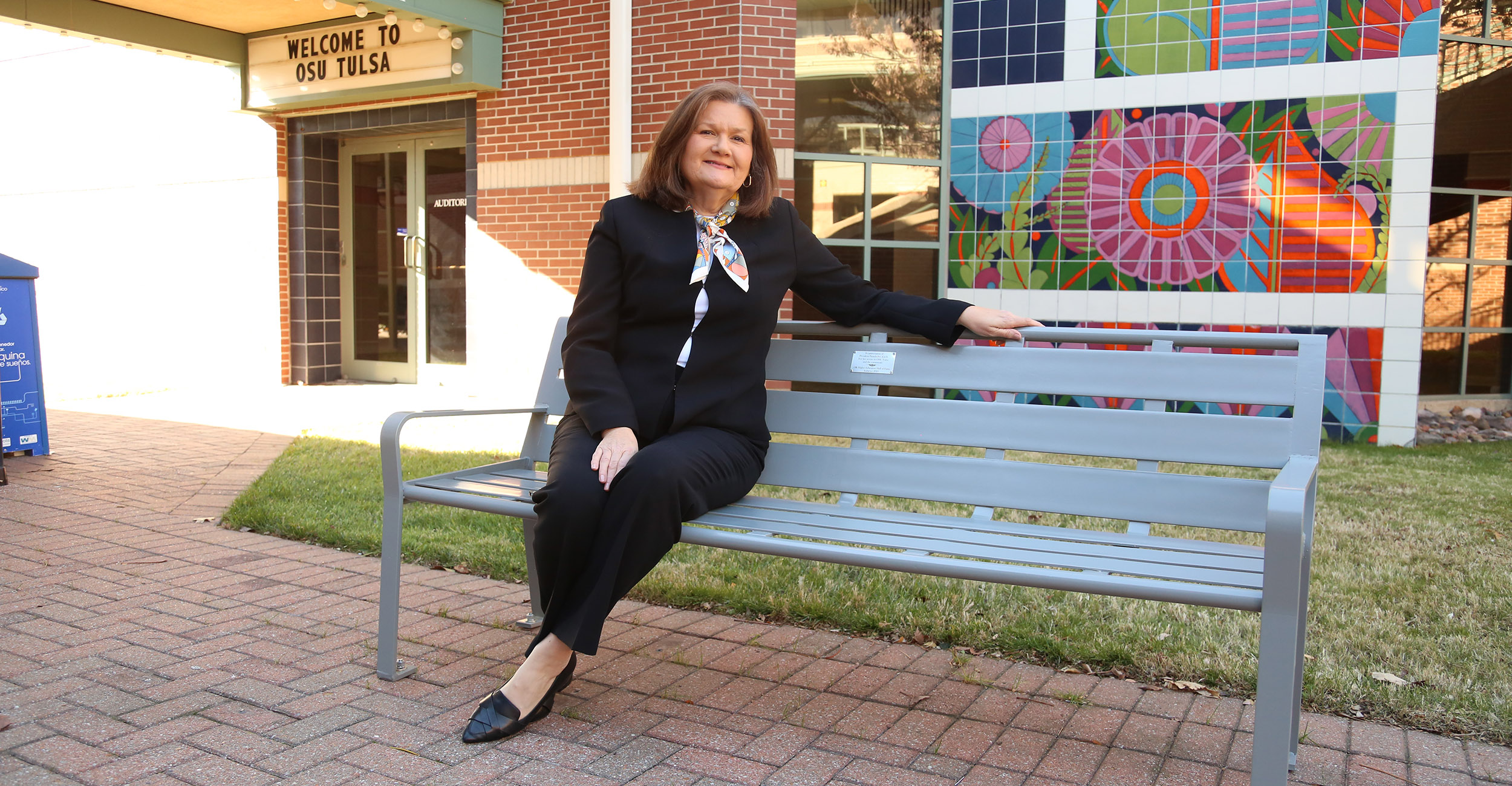 Dr. Fry sits on her newly installed bench